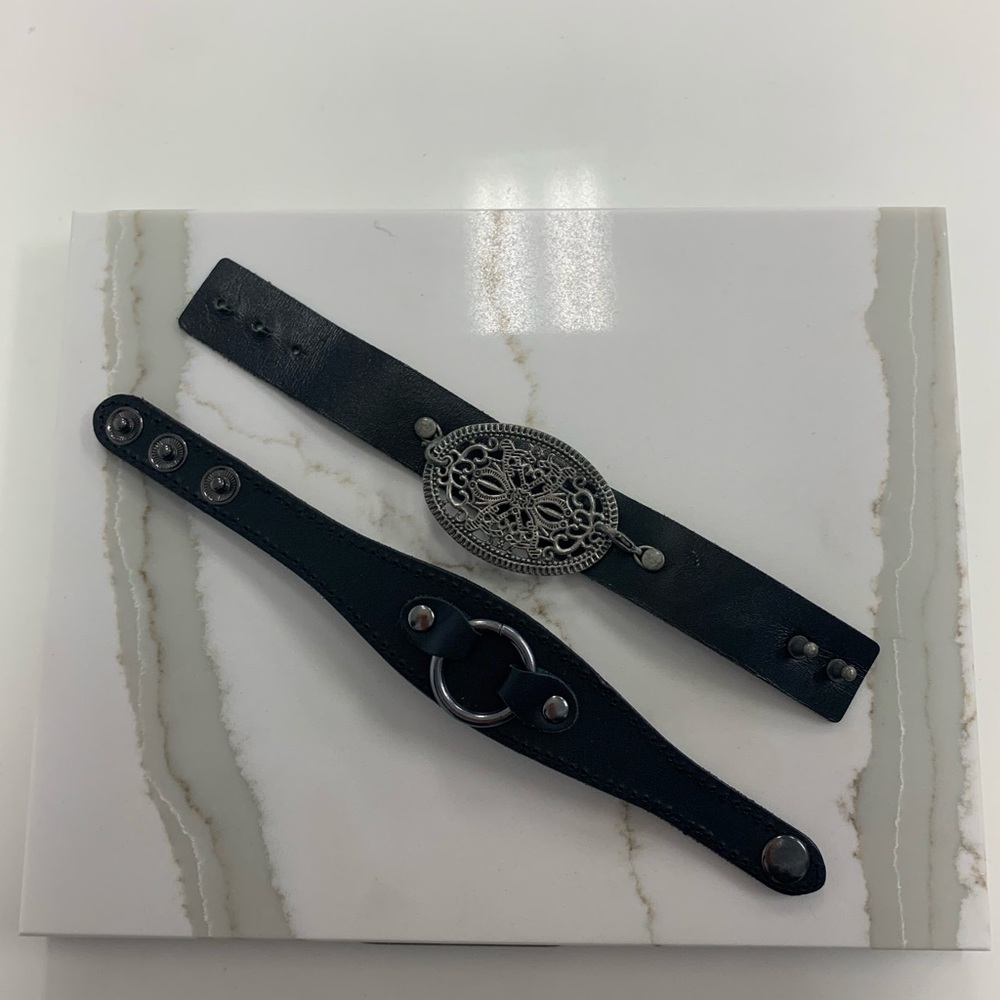 2 black wrist cuffs